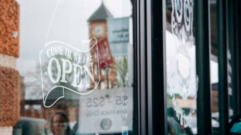 Open sign on small business in Downtown Overland Park