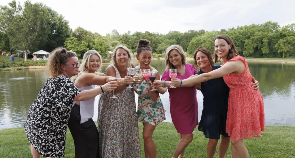 Cheers to the New Year. A group of friends toasting drinks