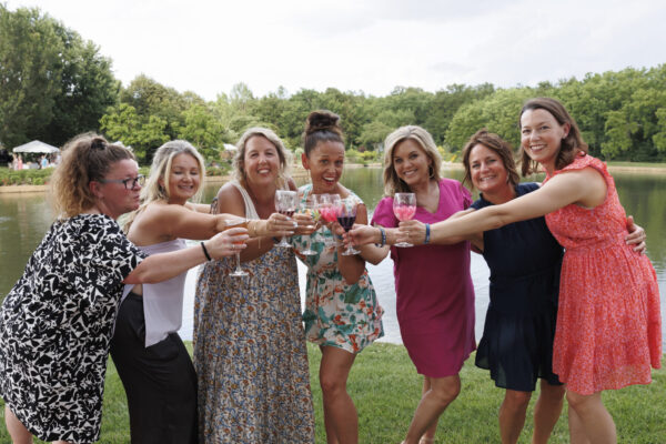Stems: A Garden Soirée Cheers to the New Year. A group of friends toasting drinks