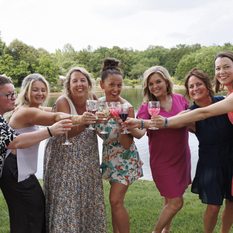 Cheers to the New Year. A group of friends toasting drinks
