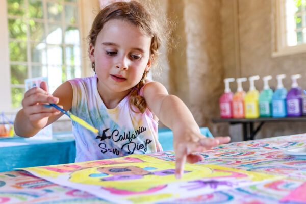 young girl painting at the downtown OP art fair