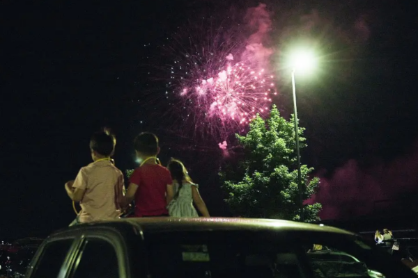 Kids enjoying the fireworks at the Red, White, and Bluhawk display