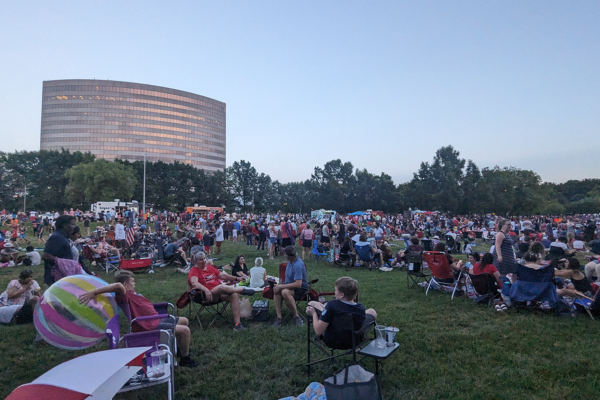 People enjoying fireworks at the Overland Park Star Spangled Spectacular