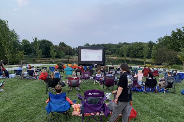 People watching a movie at the Overland Park Arboretum