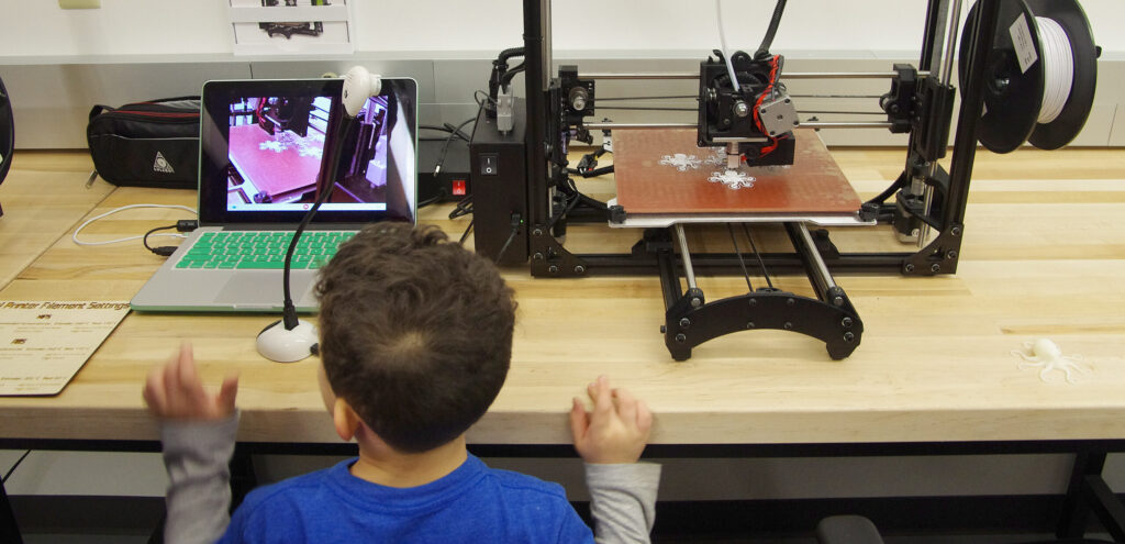 Child use the MakerSpace at Johnson County Library